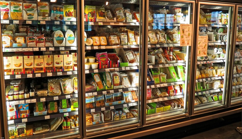 refrigerator interior with food items and smell particles illustration