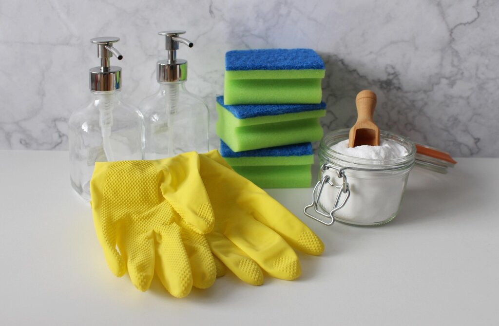 white vinegar baking soda citric acid household cleaning supplies on counter