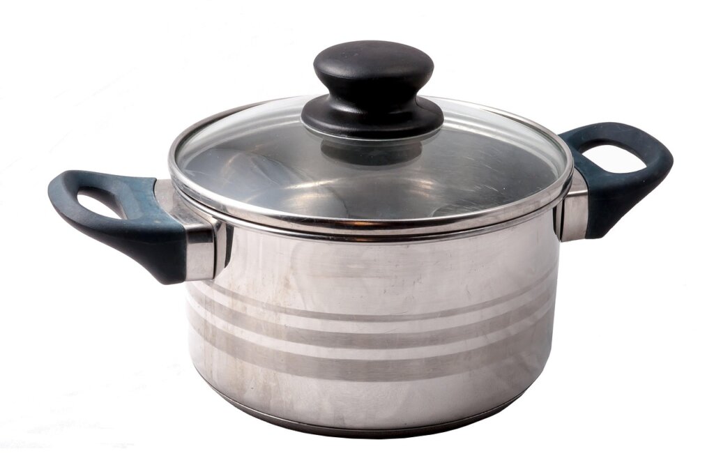 stainless steel pot and coated non-stick pan side by side on kitchen counter