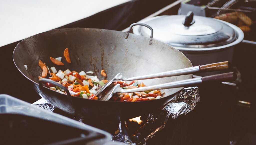 ceramic pan with silicone spatula on stove