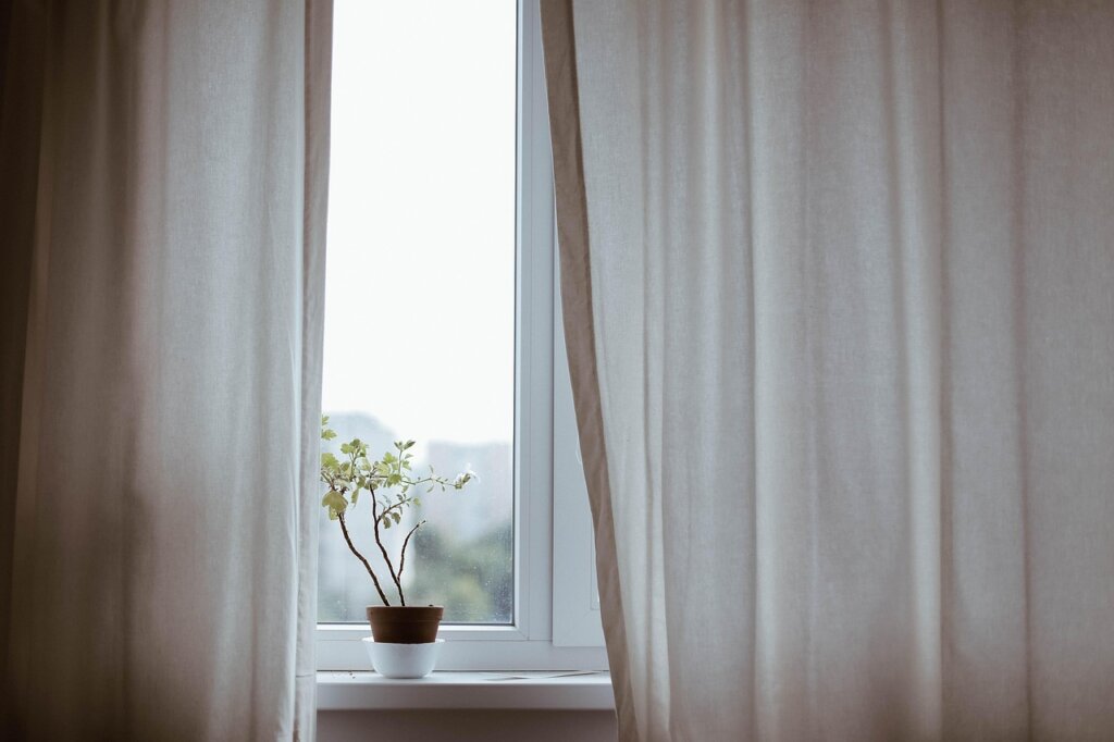 calcium chloride dehumidifier placed on window sill indoors