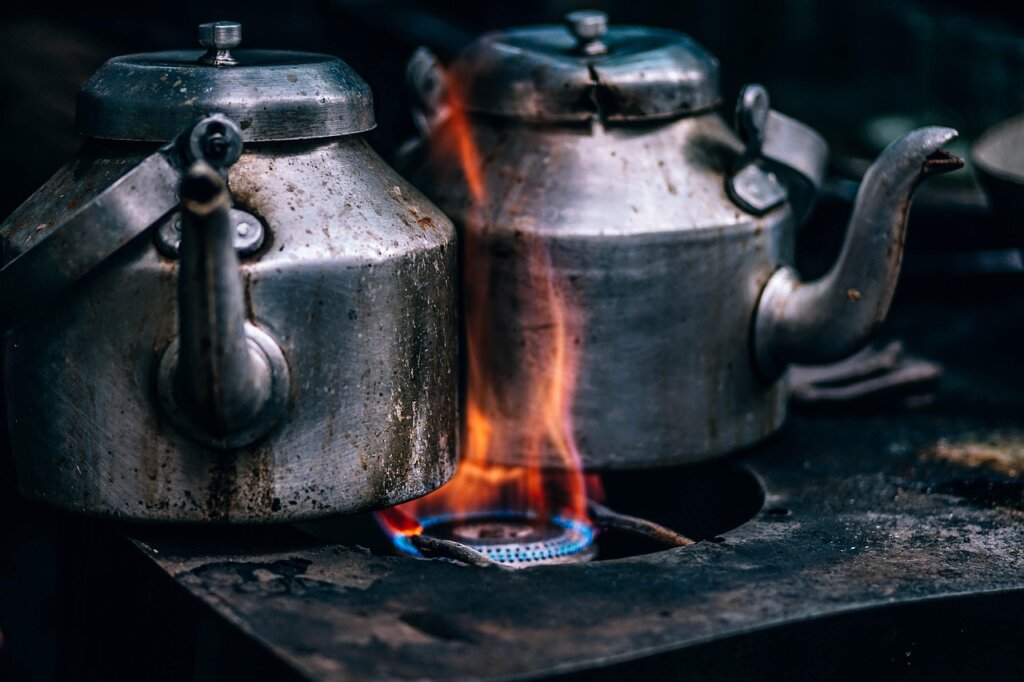 kitchen cloth boiling in pot with steam