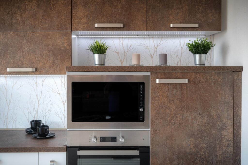 microwave oven with wet dishcloth inside, kitchen counter