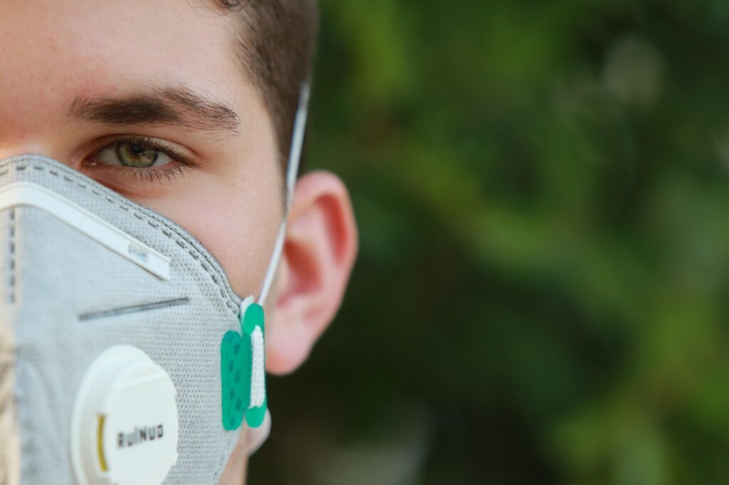 disposable face mask elastic ear loop stretched out on table