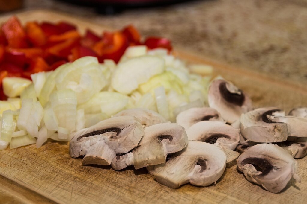 freshly oiled wooden cutting board gleaming on kitchen counter