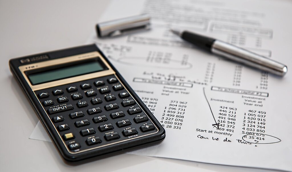 gas bill statement on table with calculator and pen winter heating cost analysis
